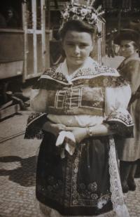 Jitka at the Wenceslas square in Prague, dressed in a folk costume sewed by her mother II.