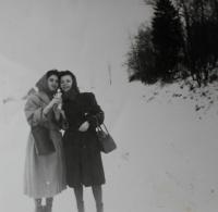Anita and Regina, her work colleague, on their way from a carnival, near Klingenthal in 1950s 