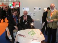Erich Guelzow of DFVLR (German Aerospace Centre) and Jiří Nor during the demonstration of the Astris golf cart, at the  Hannover Messe, Hannover, Germany 2005