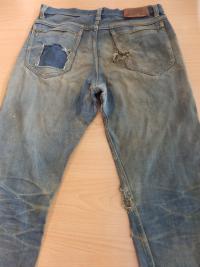 Bullet shots in Petr Šída´s jeans from 21. 8. 1968 (the right hand pocket, through which a bullet and bone fractions came out - a shot through pelvis)