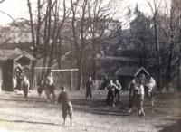 A group of Petr's friends playing dodgeball in the yard of Jewish school in Frýdek