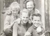 With her siblings (in the middle)