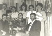 Celebrating birthday with her colleagues (in the middle)