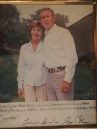 A photo of Mr. and Mrs. Bush with an inscription 