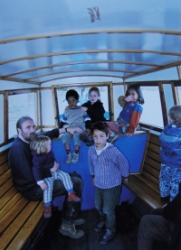 Witness´s husband on a trip to Lake Máchovo, their children Matěj (in the middle), Johana (top right), Jakub (on husband´s knee), 2003 or 2004