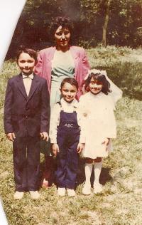 First Communion. Mária with her mother and brothers in 1988