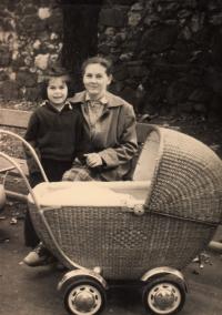 Mother Anna with her older daughter and little Libuše in the stroller (1953)