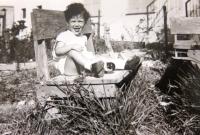 Daughter Anat on a wooden bench, 1960