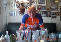 Josef Wolf with cups he won in cycling 

