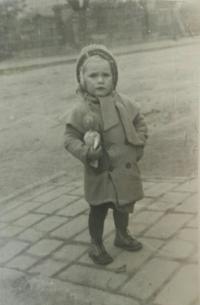 Marie as a child with a dolly
