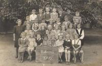 Markéta Šťastná (Jochmannová) on a school photo from the 1st grade of elementary school in Peruc in 1946