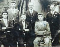 Father Karel Škráček (first left) with friends during the levy