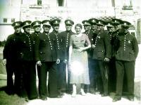 Police music band in Ostrava, 1940s, the daughter of their commander is in the middle