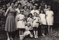 Marie Vegrichtová (4th from the left in top row; her mother towards her left; her sister towards her right), Krnov 1964 