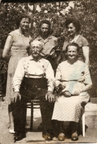 Marie (middle) with he sisters and parents