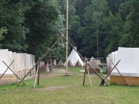 View of completed campsite. The gateway is made only with ropes without using nails, there is a stylised lily - a scout symbol on top of it , Dědov 