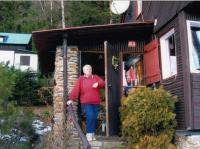 His wife Irena at their cottage in Šumava