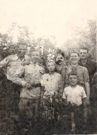 1945 (August) - Aloisie with parents and the Russian soldiers, who lived in their household