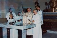 The consecrating of the repaired church in Domašov nad Bystřicí, bishop Josef Hrdlička before the altar and, on his left, the witness, Antonín Pospíšil, who repaired this church and was a priest in 1992-2005.