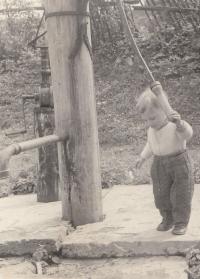 Jan Hrad as a little boy in Bílenice near Sušice, in the birthplace of his father - they had only a pump for washing