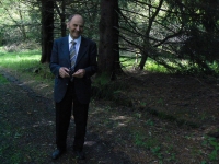 A. Rázek, standing by the wall of the former camp Nikolaj (erased traces of history)