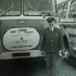The witness with his bus, decorated for mileage achieved without accidents