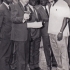 Vladimír Zikmund in Congo during the smallpox eradication campaign. He is showing a jet injector to the Minister of Health of Congo (far right, wearing a fur hat).