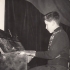 Miloš Charbuský by the piano in 1957